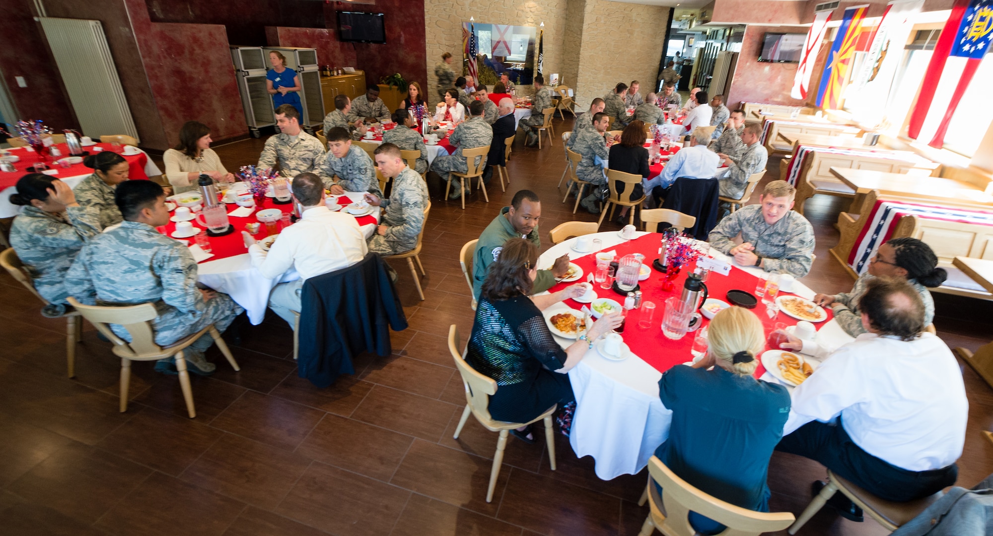 Airmen assigned here have lunch with members of a congressional delegation led by U.S. Sen. Ben Cardin, July 3.  Cardin and five other members of Congress stopped here enroute to the U.S.  (U.S. Air Force photo/ Airman 1st Class Jordan Castelan)