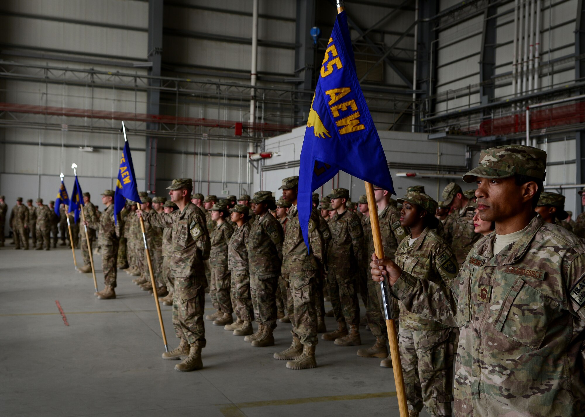 U.S. Airmen from the 455th Air Expeditionary Wing stand at parade rest during the wing’s change of command ceremony at Bagram Airfield, Afghanistan July 3, 2014.  Airmen across the wing attended the ceremony to welcome Brig. Gen. Mark Kelly as their new commander.  (U.S. Air Force photo by Staff Sgt. Evelyn Chavez/Released) 