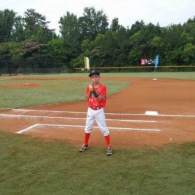 Evan Siary, pitcher for the Dirtbags, holds his game-ball after throwing a
no-hitter in the opening round of the USSSA World Series in Birmingham,
Ala., 27 June. His team took second place out of 14 teams in the tournament.
(Courtesy photo)
