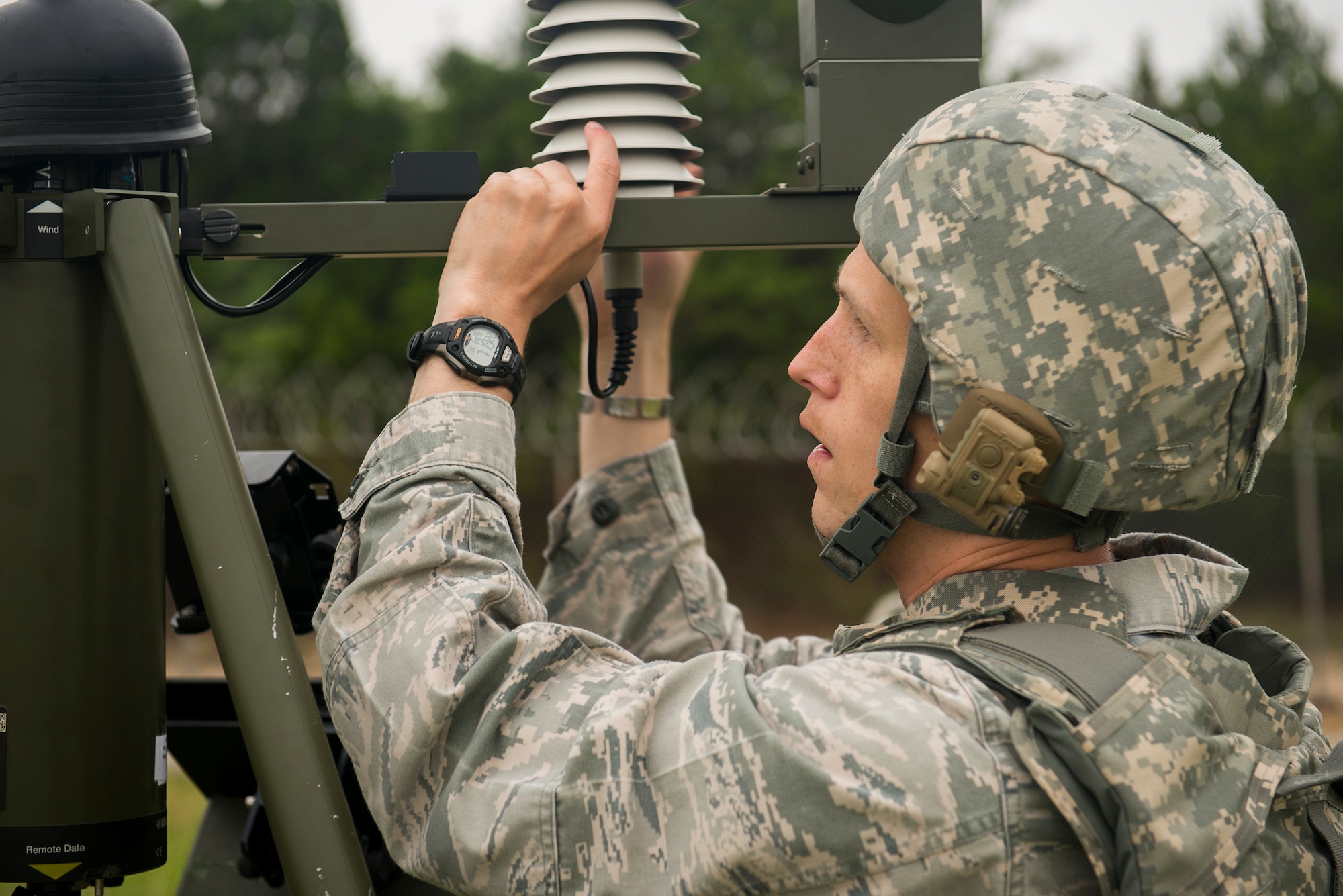 U.S. Air Force Capt. Andrew Williams, 3d Weather Squadron Det. 2 commander, assembles a tactical meteorological observing system at Fort Hood, Texas, June 26, 2014. Airmen from the 3d WS deploy with a TMOS to support Army and Air Force operations. (U.S. Air Force photo by Airman 1st Class Ryan Callaghan/Released)