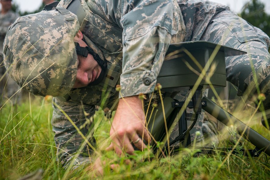 U.S. Air Force 2nd Lt. Glenn Harrison, 3d Weather Squadron officer in charge of brigade combat team operations, assembles part of a tactical meteorological observing system at Fort Hood, Texas, June 26, 2014. The TMOS measures elements such as wind speed, temperature, humidity and cloud levels. (U.S. Air Force photo by Airman 1st Class Ryan Callaghan/Released)