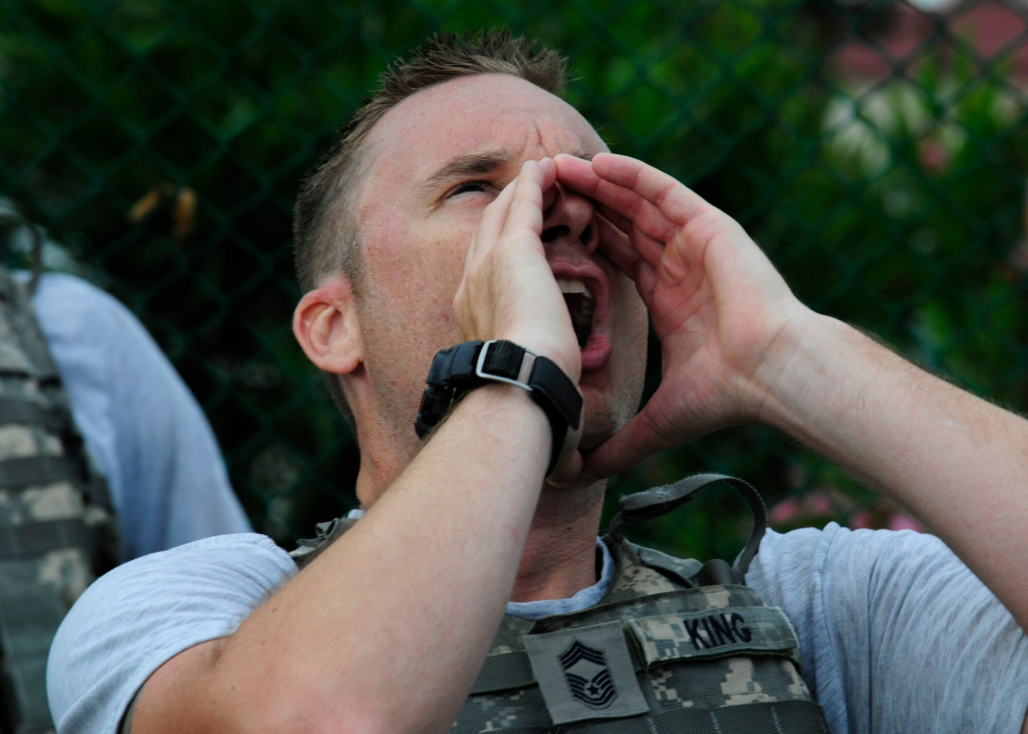 Chief Master Sgt. Scott King, 31st Security Force Squadron manager, motivates his Airmen with a sound off after an early-morning physical training session, July 1, 2014, at Aviano Air Base, Italy. Security forces Airmen are the first line of defense against all threats to force protection and they offer their life for the cause. (U.S. Air Force photo/Airman 1st Class Ryan Conroy) 
