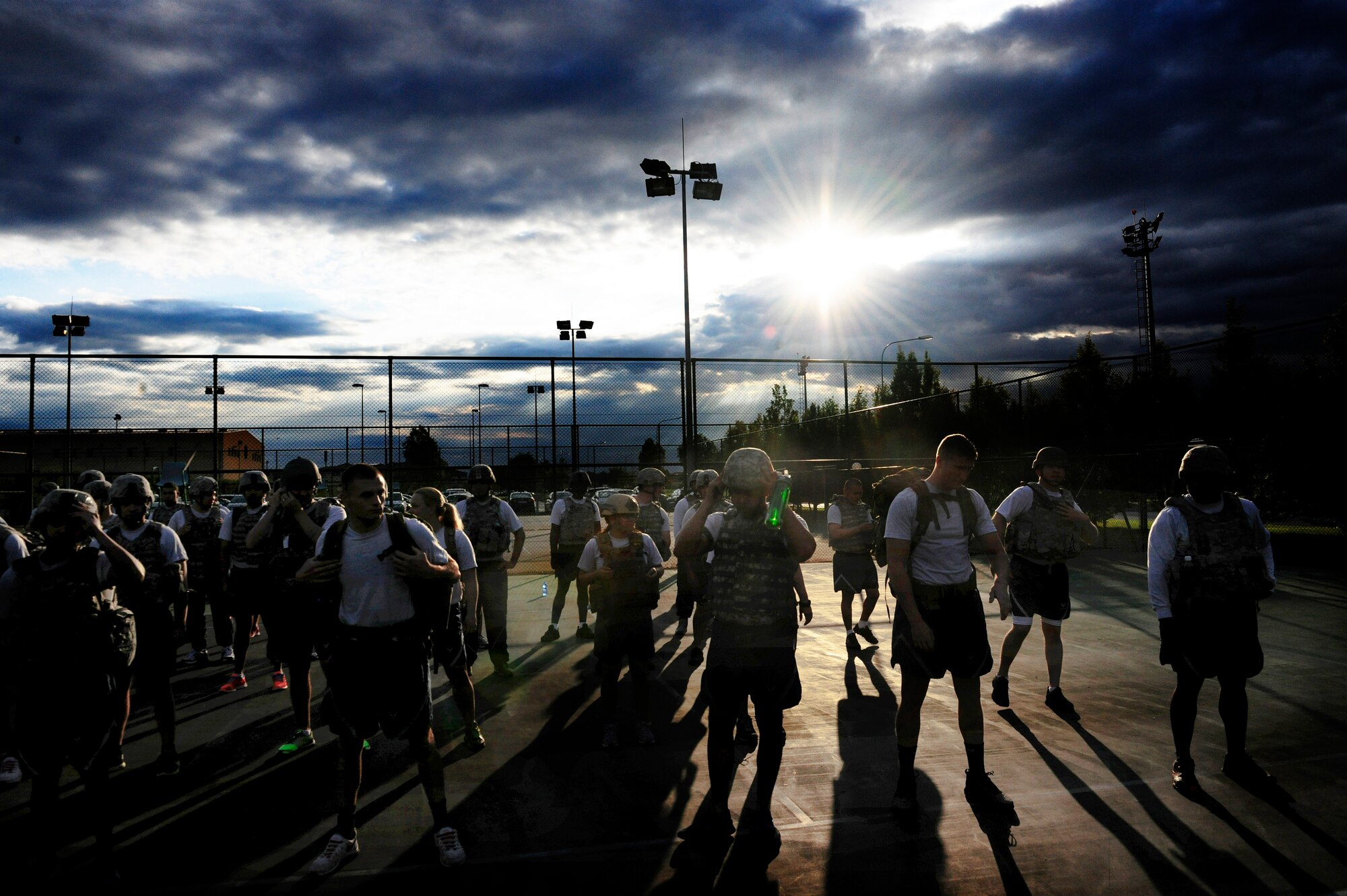31st Security Forces Squadron Airmen form up for an early-morning physical training session, July 1, 2014, at Aviano Air Base. The defenders ran 45 minutes in body armor and Kevlar helmets to maintain agility in combat gear. (U.S. Air Force photo/Airman 1st Class Ryan Conroy) 
