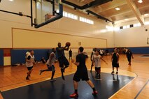 A member from the 18th Security Forces Squadron goes for a lay-up, Kadena Air Base, Japan, July 3, 2014. The basketball game was one of many events in the “Battle of the Badge” competion between the two squadrons.(U.S. Air Force photo by Airman 1st Class Stephen G. Eigel) 