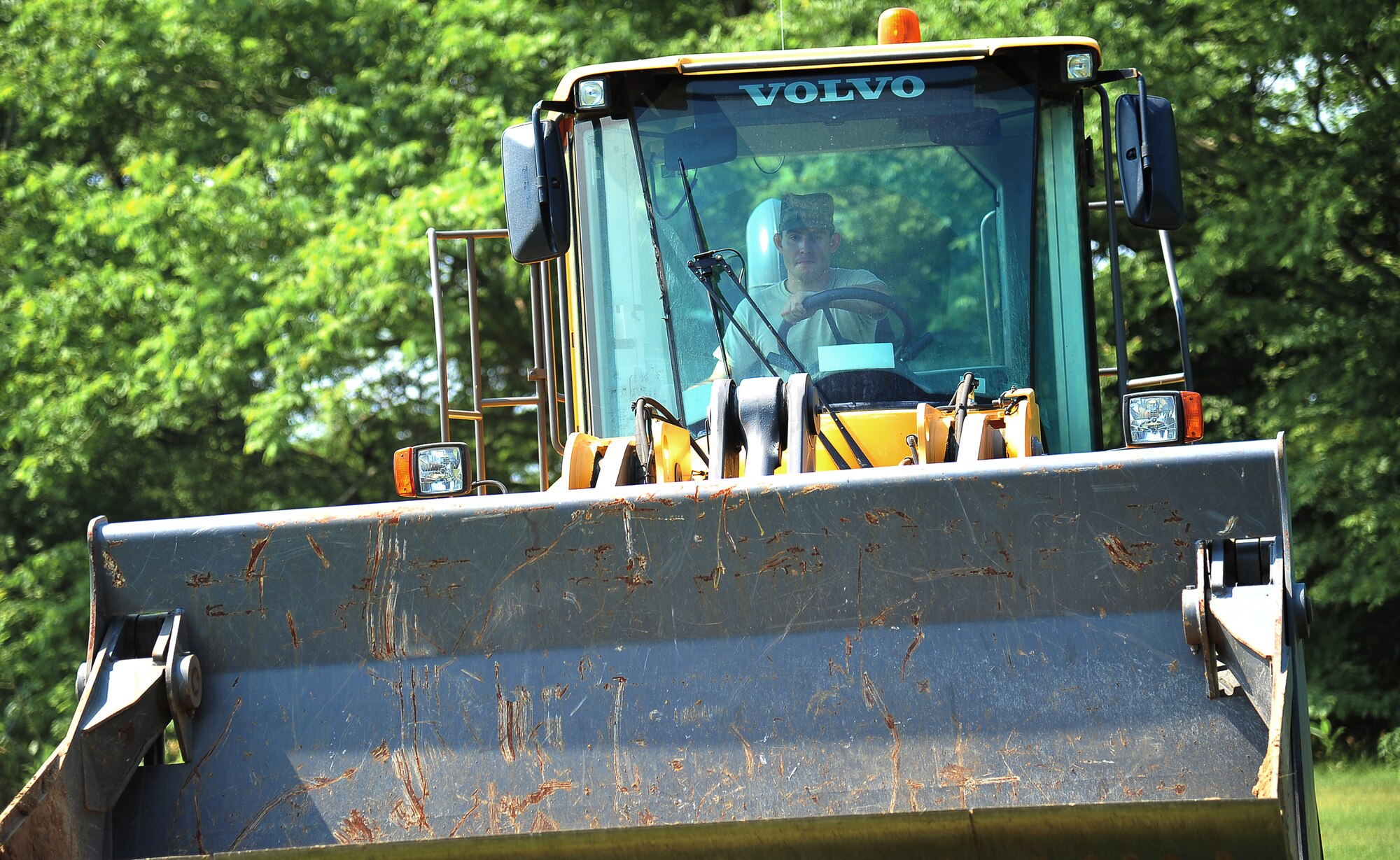 U.S. Air Force Senior Airman Michael Jones, 35th Civil Engineer Squadron heavy equipment and pavements journeyman, parks a bulldozer at Misawa Air Base, Japan, July 2, 2014. This bulldozer was used to bring sand to the Leftwich Park baseball field and help even out the grounds. (U.S. Air Force photo/Senior Airman Jose L. Hernandez-Domitilo)