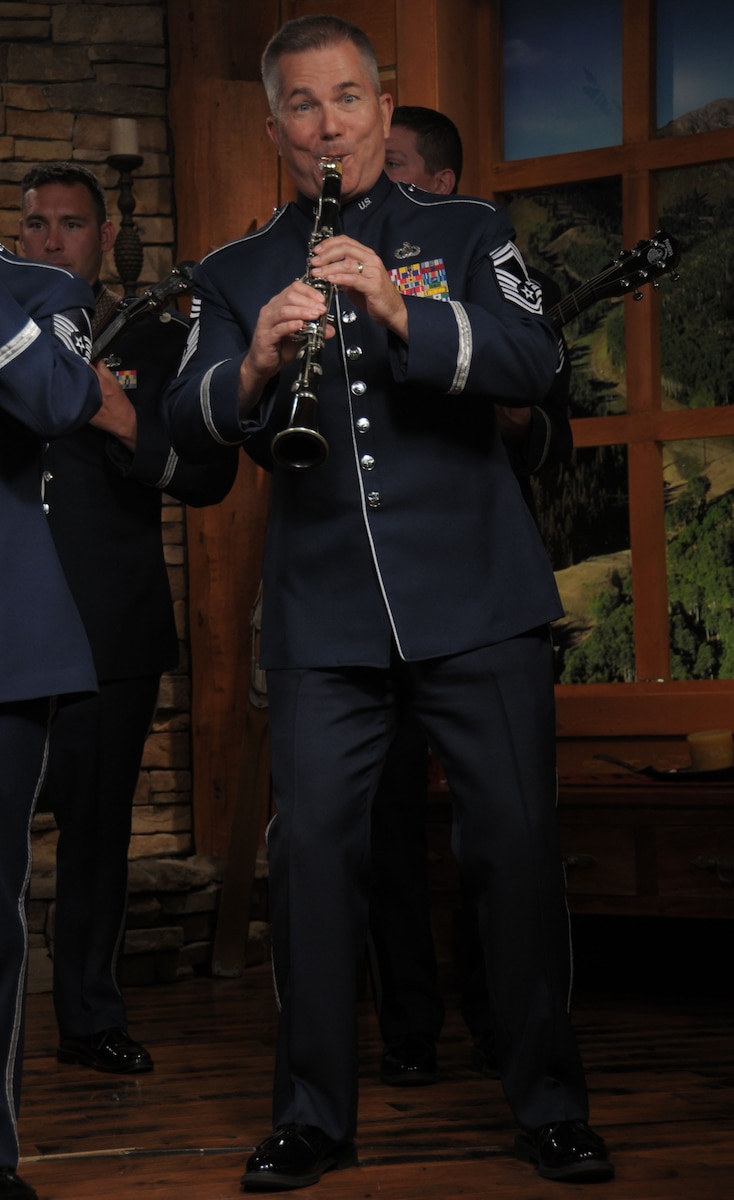 U.S. Air Force Chief Master Sgt. Jurgen Schwarze, member of the Tailgaters with the Air National Guard band of the West Coast performs on the Park City Television Station in Park City, Utah on July 1, 2014. (U.S. Air Natioal Guard photo by Airman 1st Class Madeleine Richards/Released)