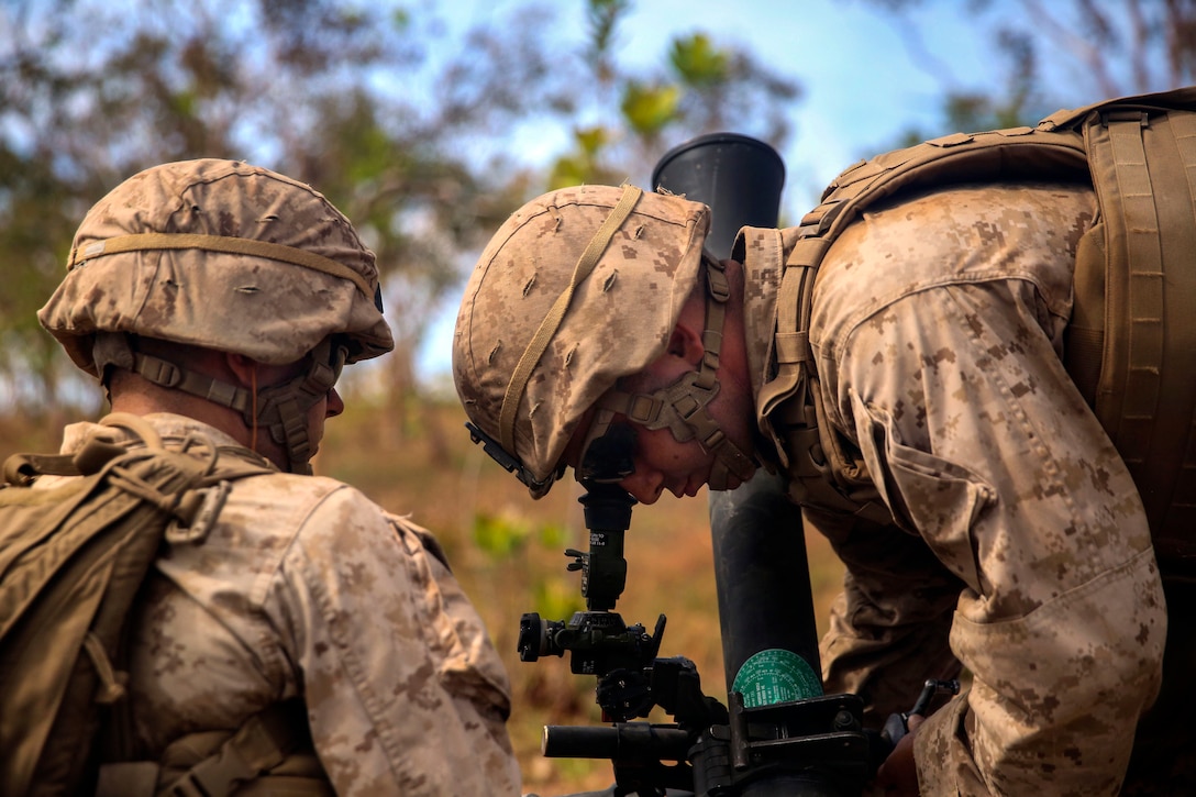 U.S. Marines prepare an 81mm mortar system during a crewed-served weapons competition on Mount Bundey Training Area, Australia, June 19, 2014. The competition was designed to test the Marines' proficiency with various weapons systems. 