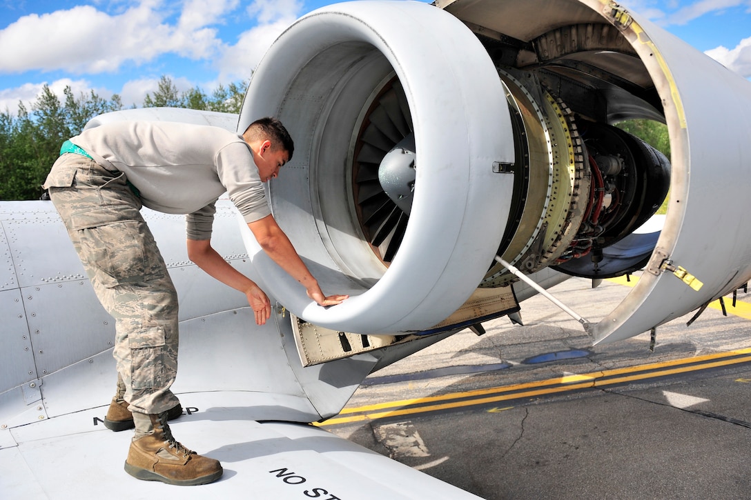 Air Force Airman 1st Class Vincent Hale checks for any cracks on an A-10 Thunderbolt II during Red Flag-Alaska 14-2 on Joint Pacific Alaska Range Complex, Alaska, June 20, 2014. Hale, an aircraft maintainer, is assigned to the 51st Aircraft Maintenance Squadron on Osan Air Base, South Korea.