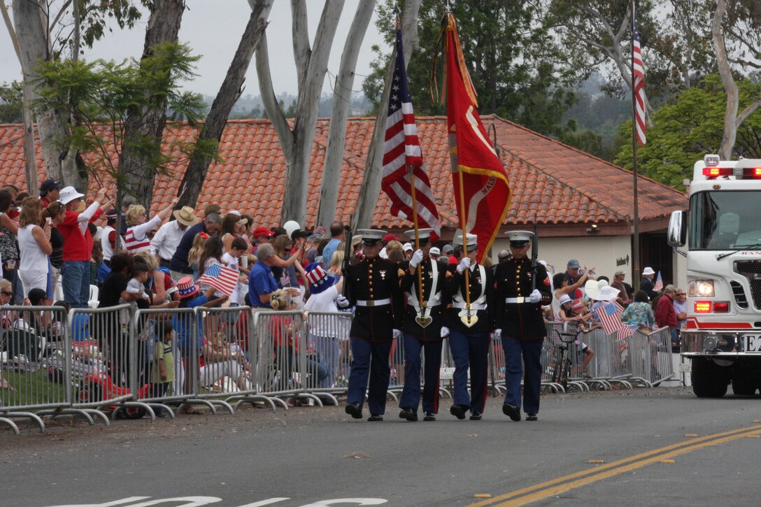 The Marine Aviation Logistics Squadron 11 Color Guard with Marine Corps Air Station Miramar, Calif., presents the colors at the 31st annual Rancho Santa Fe Fourth of July parade, July 4. After the singing of the national anthem, the color guard began the parade.(Photo courtesy of Cpl. Raquel Barraza)


