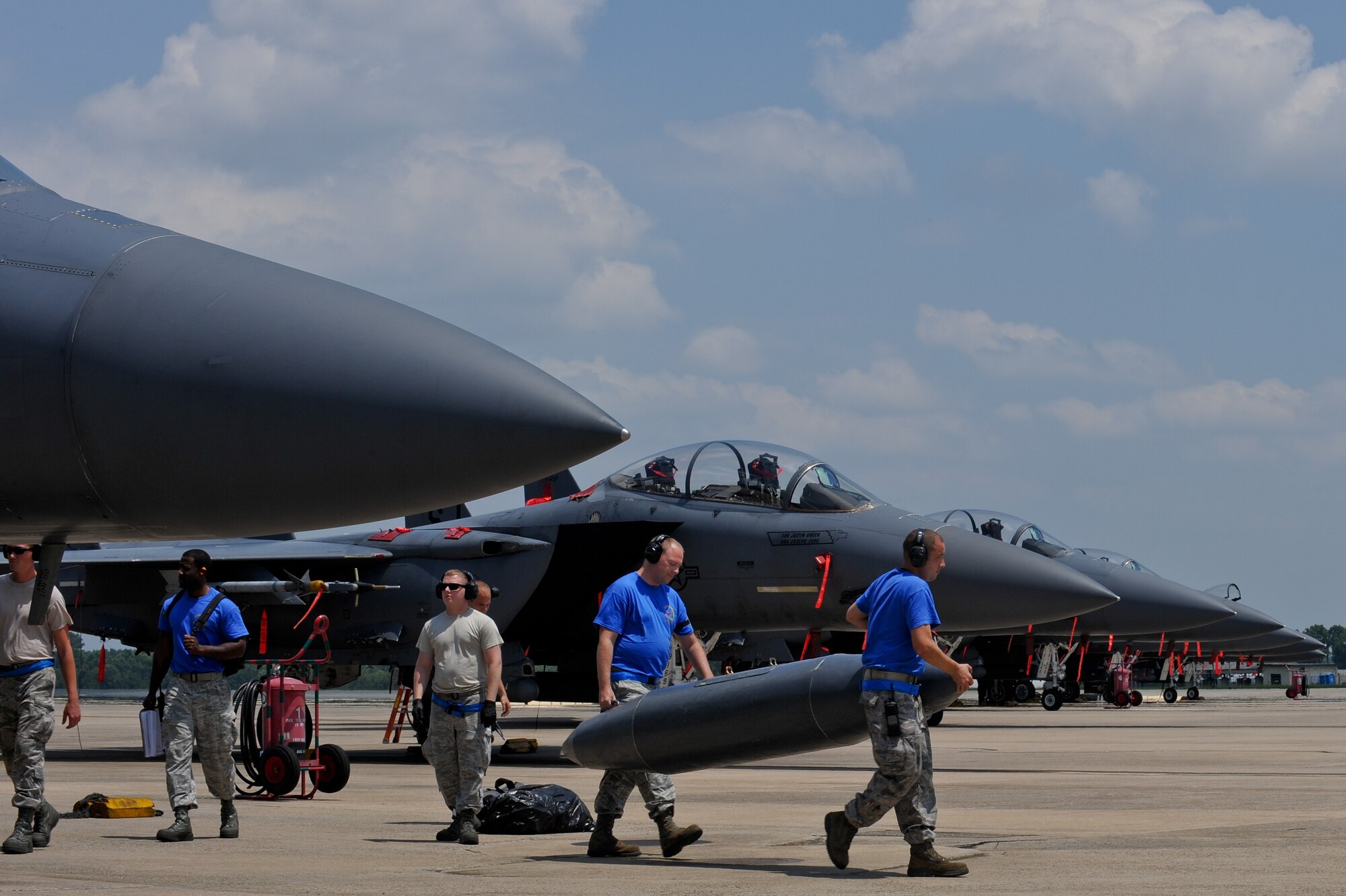 Airmen assigned to the 4th Aircraft Maintenance Squadron tend to F-15E Strike Eagle Aircraft July 4, 2014, at Seymour Johnson Air Force Base, North Carolina. More than 50 Strike Eagle aircraft returned home after being repositioned at Wright Patterson Air Force Base, Ohio, as a precaution for Hurricane Arthur. (U.S. Air Force photo/Airman 1st Class Aaron J. Jenne)