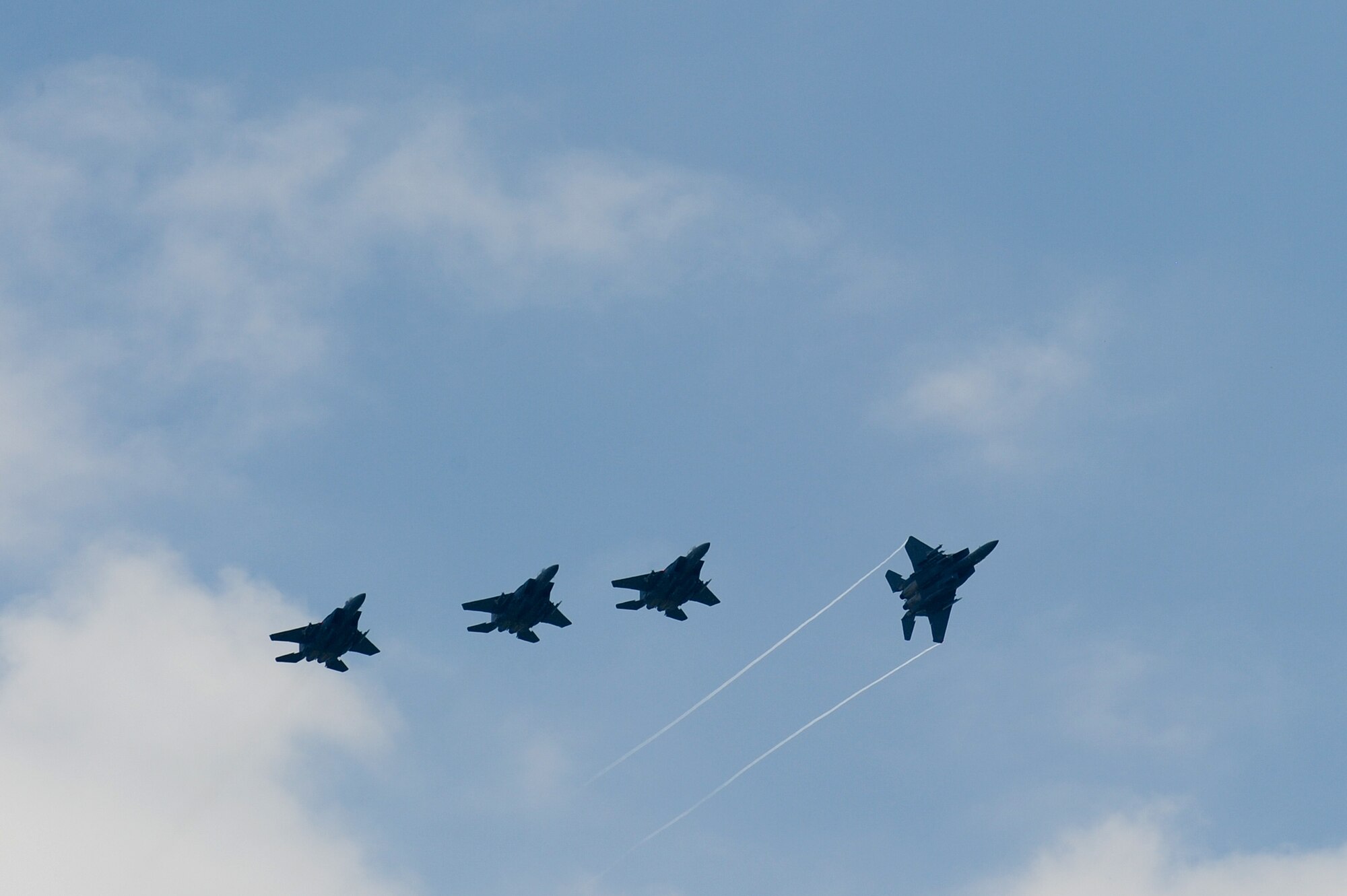 F-15E Strike Eagle aircraft fly in formation as they return from Wright Patterson Air Force Base, Ohio, July 4, 2014, at Seymour Johnson Air Force Base, North Carolina. More than 50 Strike Eagle aircraft were repositioned at Wright Patterson AFB, Ohio, as a precaution for Hurricane Arthur. (U.S. Air Force photo/Airman 1st Class Aaron J. Jenne)