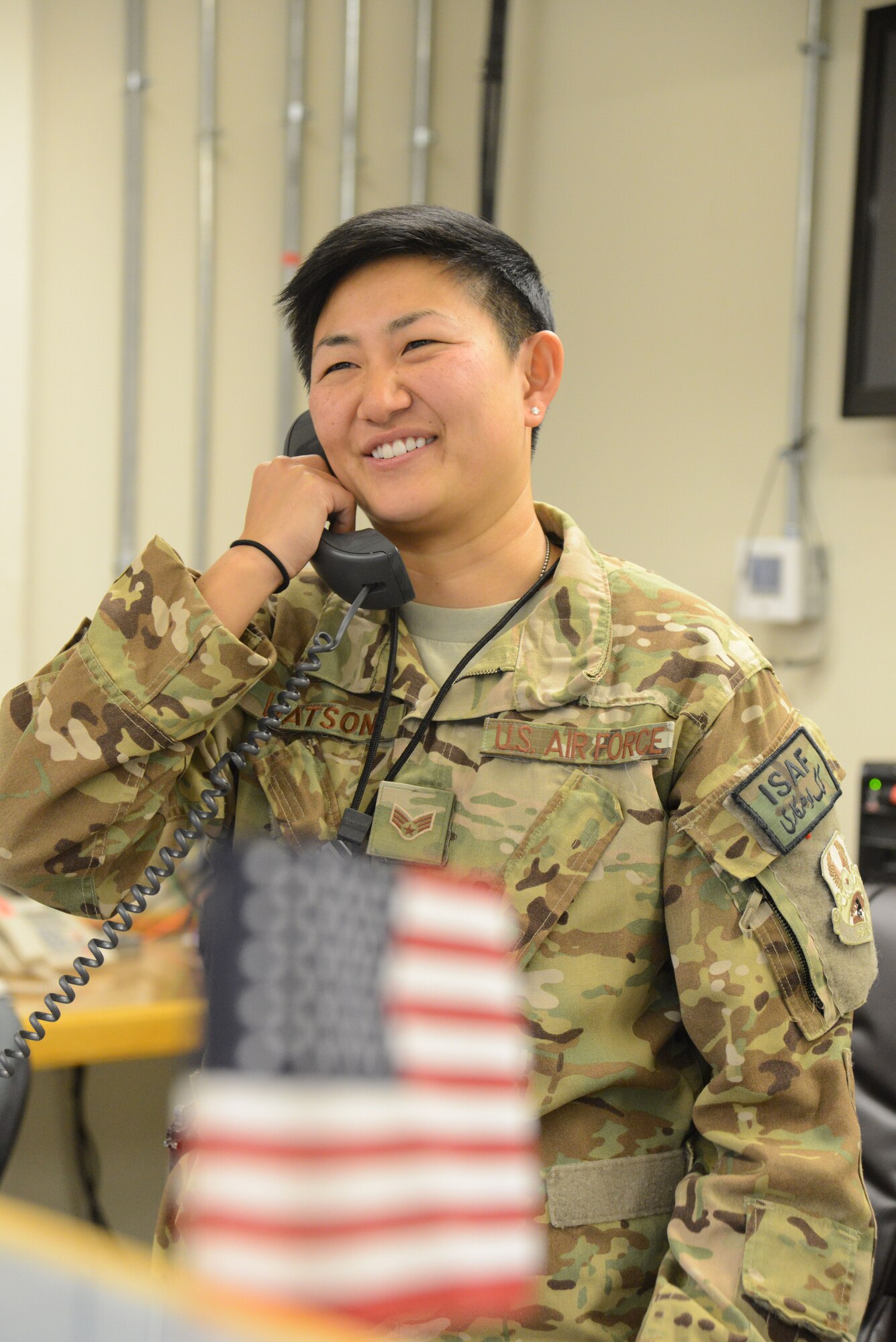 U.S. Air Force Senior Airman Ashley Watson, a sensor operator assigned to the 4th Expeditionary Reconnaissance Squadron, Bagram Airfield, Afghanistan smiles during a phone conversation with Secretary of Defense Chuck Hagel July 4, 2014. Secretary Hagel called a member from each service on the Fourth of July to thank them for their service while deployed. Watson is a native of Aiken, S.C. and deployed from the 427th Reconnaissance Squadron, Beale Air Force Base, Calif.
