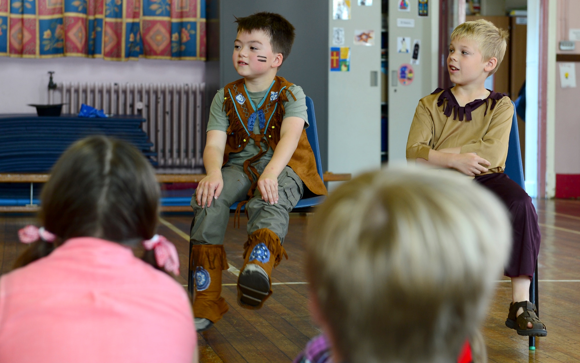Drew Heitmeyer, 8, and Caleb Kaercher, 7, Guildhall Feoffment Primary School students, answer questions from British students about living in the U.S. compared to living in the U.K., July 2, 2014. Students participated in various hands-on activities to learn about American history during the school’s America Week. (U.S. Air Force photo by Airman 1st Class Dawn M. Weber/Released)