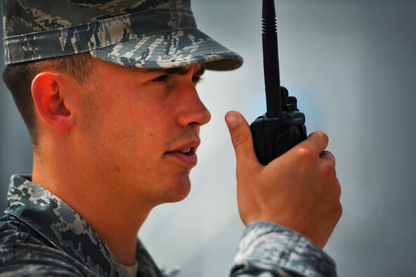 Senior Airman Nathan Mahoney, 380th Expeditionary Security Forces force protection escort, observes contracted workers July 3, 2014, at an undisclosed location in Southwest Asia. Mahoney, deployed from Anderson Air Base, Guam, has been recognized as a 380th Air Expeditionary Wing warrior of the week. (U.S. Air Force photo by Tech. Sgt. Russ Scalf/Released)