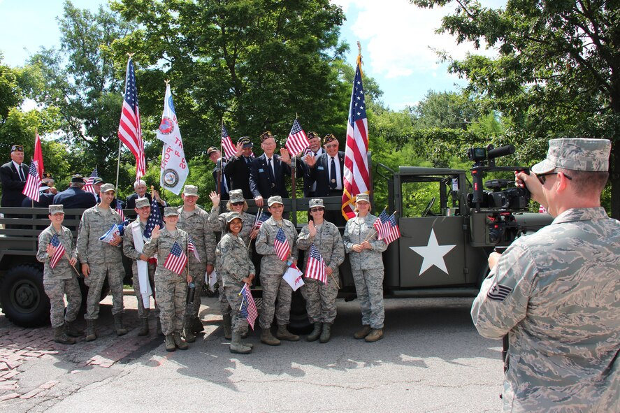 Airmen of the 932nd Airlift Wing, an Air Force Reserve Command unit in Illinois, gathered to meet fellow veterans at the Independence Day parade in Forest Park near the Saint Louis zoo.  They all had great attitudes and enjoyed the three miles they walked for fun and fitness.  At right is Tech. Sgt. Chris Parr who caught some of the special moments on video July 4th, 2014.  (U.S. Air Force photo/Maj. Stan Paregien)  