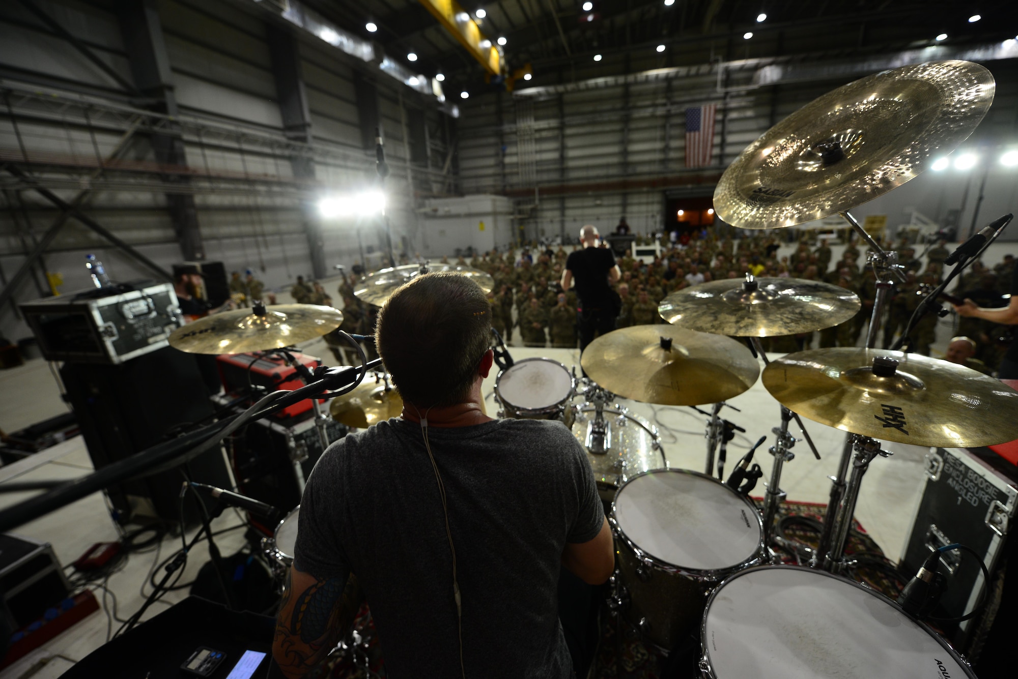 Vertical Horizon band member Ron Lavella plays the drums during a performance for service members at Bagram Airfield, Afghanistan July 4, 2014.  Stars for Stripes sponsored the event for Airmen, Soldiers, Sailors and Marines here, the concert was part of a sequence of events for the holiday.  (U.S. Air Force photo by Staff Sgt. Evelyn Chavez)