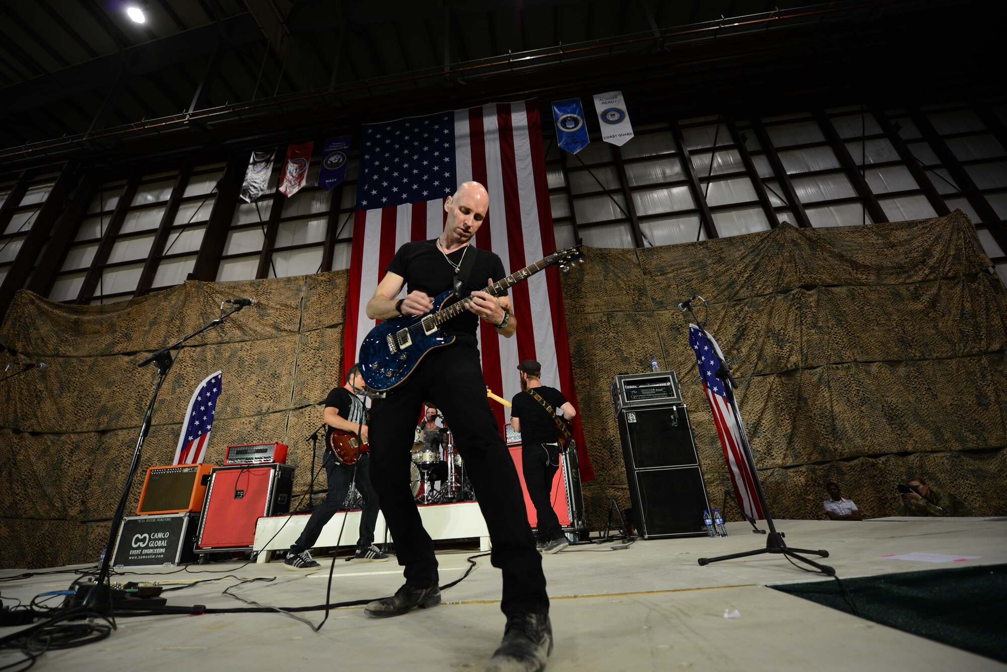 Vertical Horizon band member Matt Scannell plays the guitar during a performance for service members at Bagram Airfield, Afghanistan July 4, 2014.  Stars for Stripes sponsored the event for Airmen, Soldiers, Sailors and Marines here, the concert was part of a sequence of events for the holiday.  (U.S. Air Force photo by Staff Sgt. Evelyn Chavez)