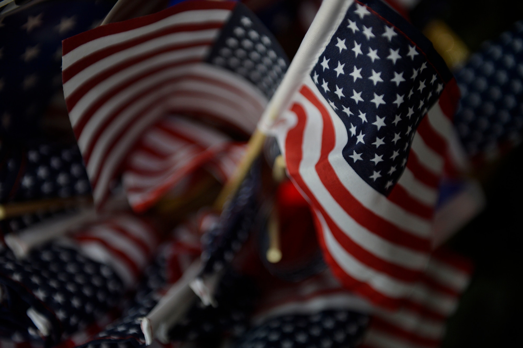 American flags were given to service during a Fourth of July celebration at Bagram Airfield, Afghanistan July 4, 2014.  Basketball, tug-of-war and volleyball were activities to enjoy during the holiday. (U.S. Air Force photo by Staff Sgt. Evelyn Chavez/Released)