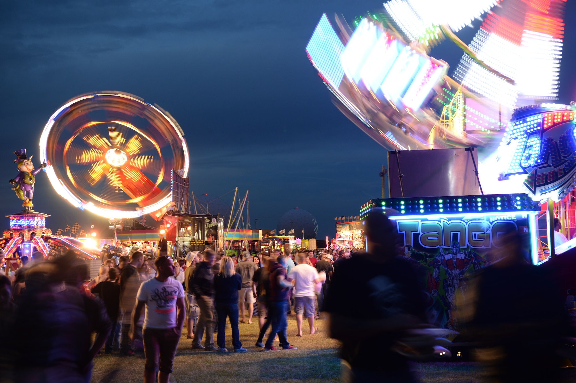 Royal Air Force Feltwell, England, hosted a celebration July 4, 2014. The free, public event featured many events and activities, including rides, games, food booths, an aerial demonstration from the RAF Red Arrows, and a fireworks display. (U.S. Air Force photo by Staff Sgt. Emerson Nuñez/Released)