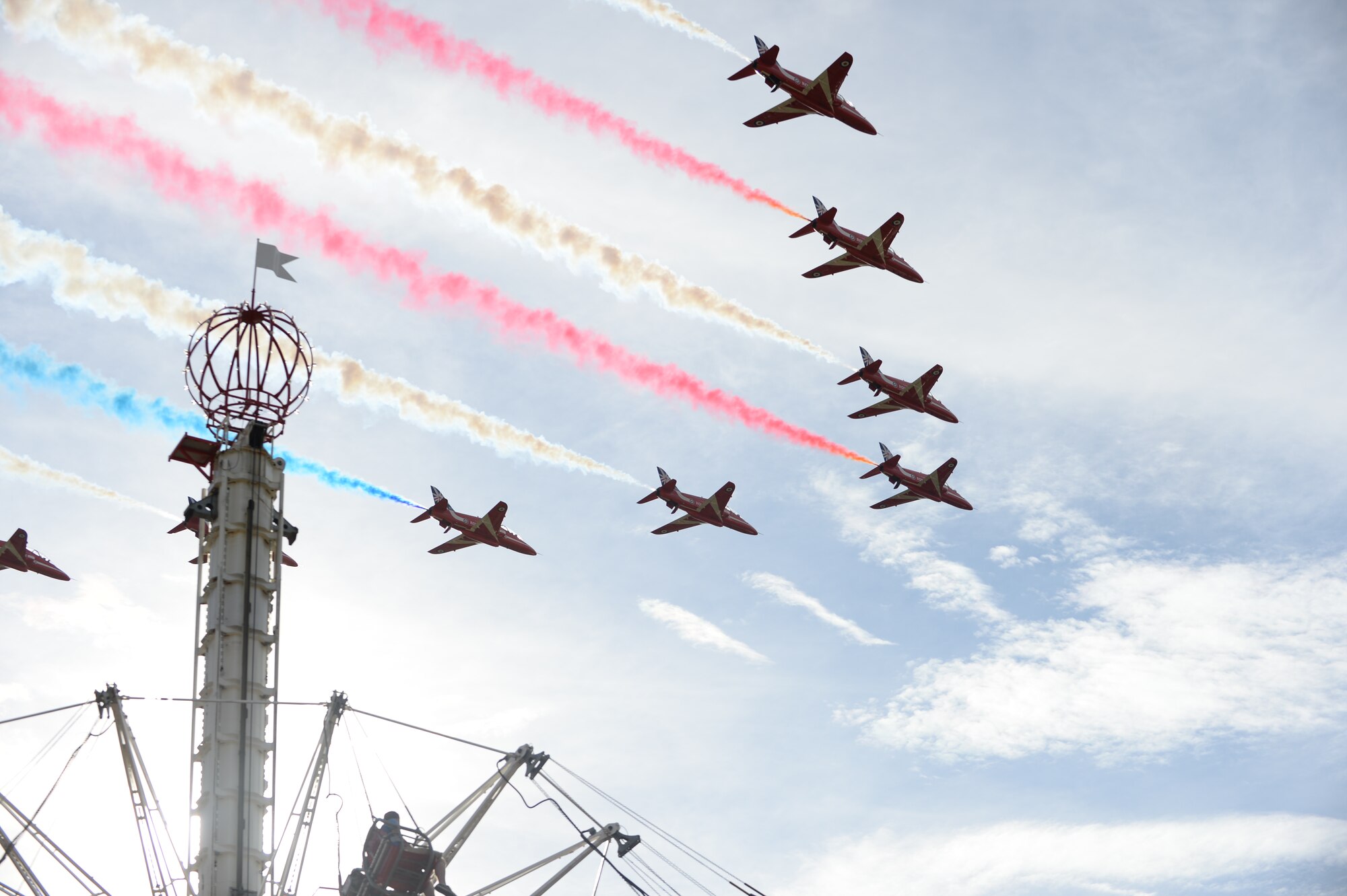 Royal Air Force Feltwell, England, hosted a celebration July 4, 2014. The free, public event featured many events and activities, including rides, games, food booths, an aerial demonstration from the RAF Red Arrows, and a fireworks display. (U.S. Air Force photo by Staff Sgt. Emerson Nuñez/Released)