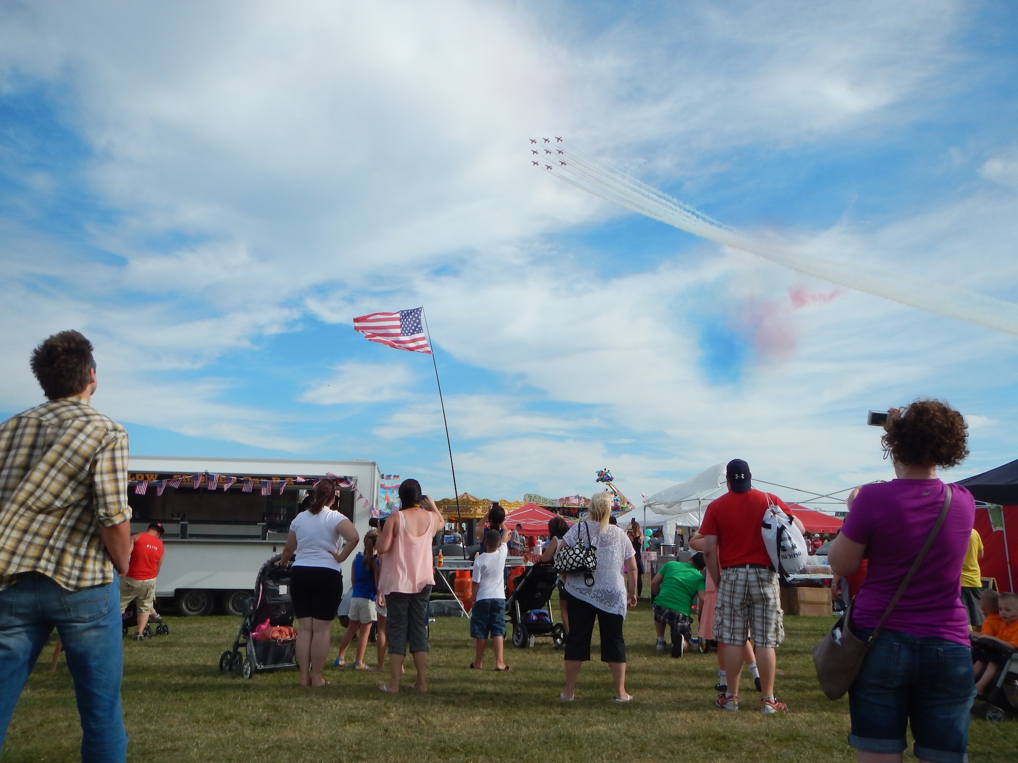 Royal Air Force Feltwell, England, hosted a celebration July 4, 2014. The free, public event featured many events and activities, including rides, games, food booths, an aerial demonstration from the RAF Red Arrows, and a fireworks display. (U.S. Air Force photo by Staff Sgt. Thomas Trower/Released)