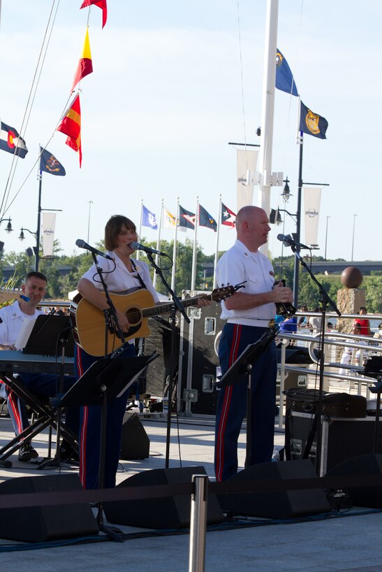 On July 5, 2014, Free Country, the Marine Band's contemporary country music ensemble, performed at National Harbor in Maryland. Pictured, Master Gunnery Sgts. Amy Horn and Peter Wilson. (U.S. Marine Corps photo released/Gunnery Sgt. Amanda Simmons)