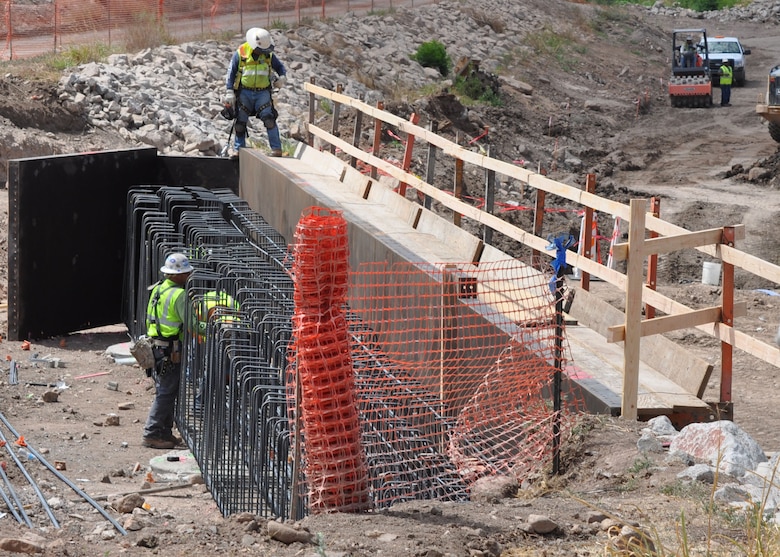 Contractors work on an abutment for the bridge across the Chula Vista Wash June 18 in Nogales, Ariz. The U.S. Army Corps of Engineers Los Angeles District is working to replace the bridge it removed during a previous construction project.