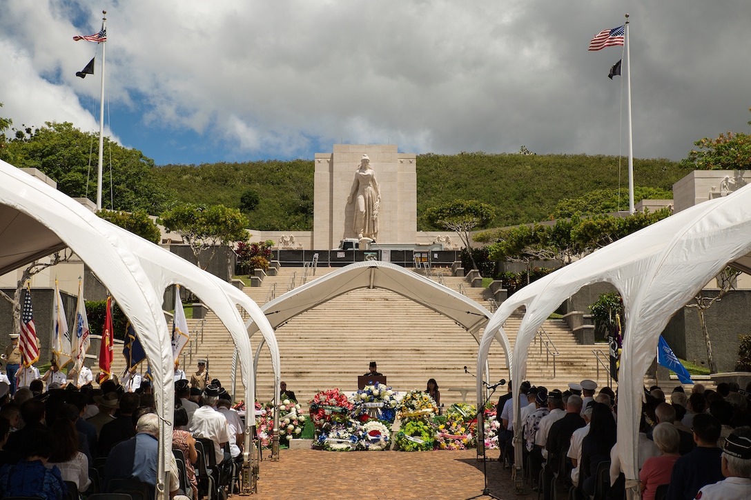 Many were gathered at the 64th annual Korean War memorial ceremony at the National Memorial Cemetery of the Pacific, June 25, 2014. The ceremony commemorated U.S. and Republic of Korea veterans, both living and dead, who fought for the freedom of South Korea, and guests in attendance laid wreaths at the base of the memorial to honor those who gave their lives. (U.S. Marine Corps photo by Cpl. Matthew J. Bragg)