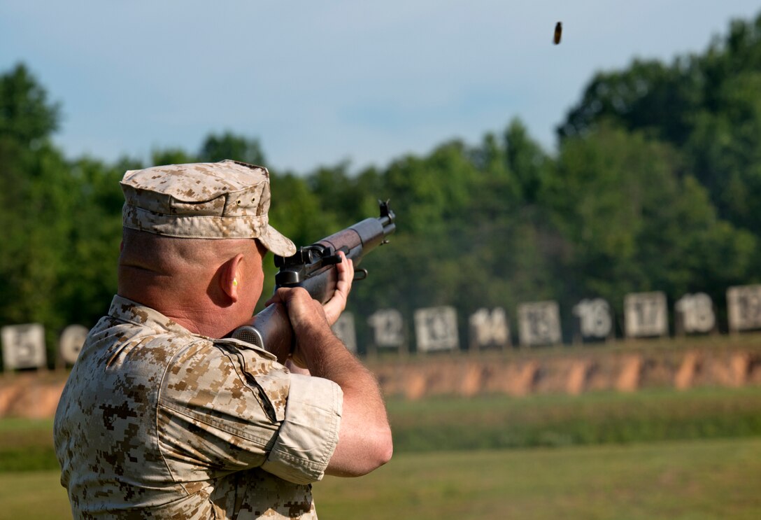 Col. Austin E. Renforth, commanding officer of Marine Corps Training Command, signals the start of the 53rd Annual Interservice Rifle Championship with a shot from an M-1 Garand at Range 4, Weapon Training Battalion aboard Marine Corps Base Quantico July 6, 2014. Service members have shared the knowledge learned from this event with their individual services to advance the U.S. military’s efficiency in combat.