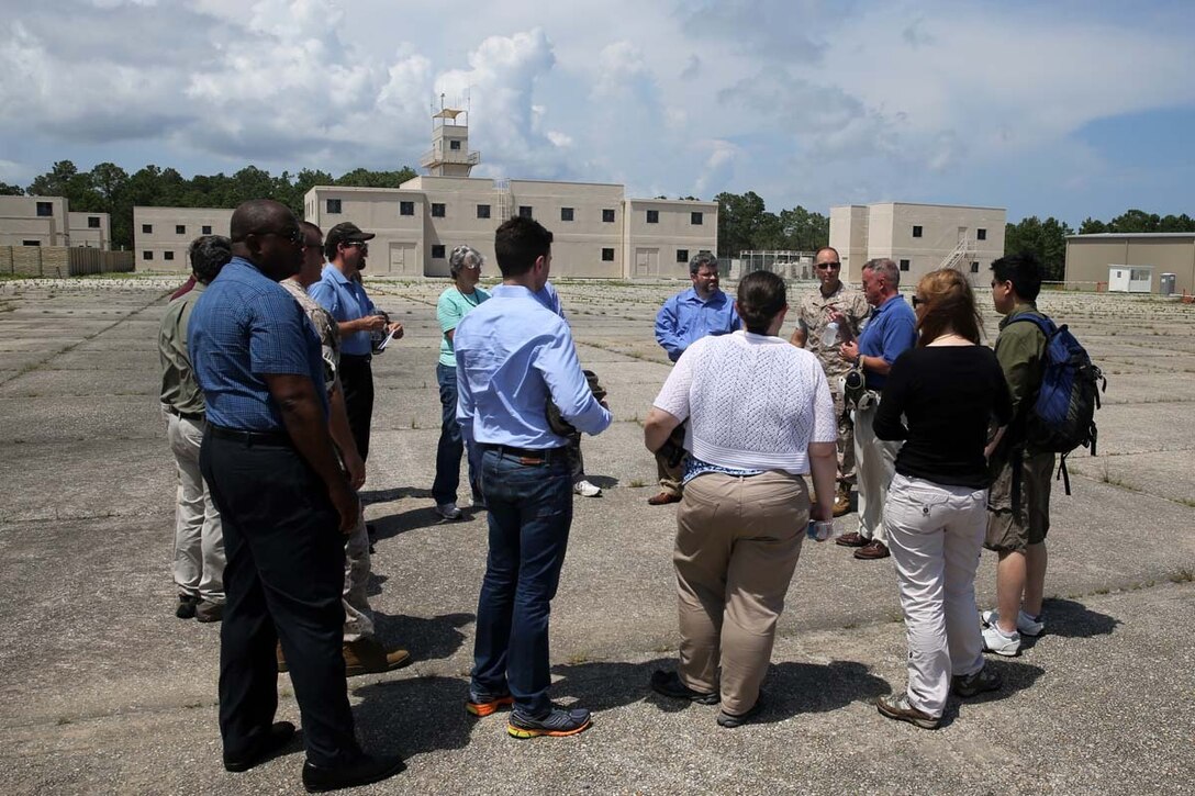 Department of Defense and governmental budget officials tour a new Military Operation on Urban Terrain town at Marine Corps Outlying Field Atlantic, N.C., June 25, 2014.  The representatives toured Marine Corps Air Station Cherry Point, N.C., and its outlying training facilities to examine the effects of encroachment on critical Cherry Point training.