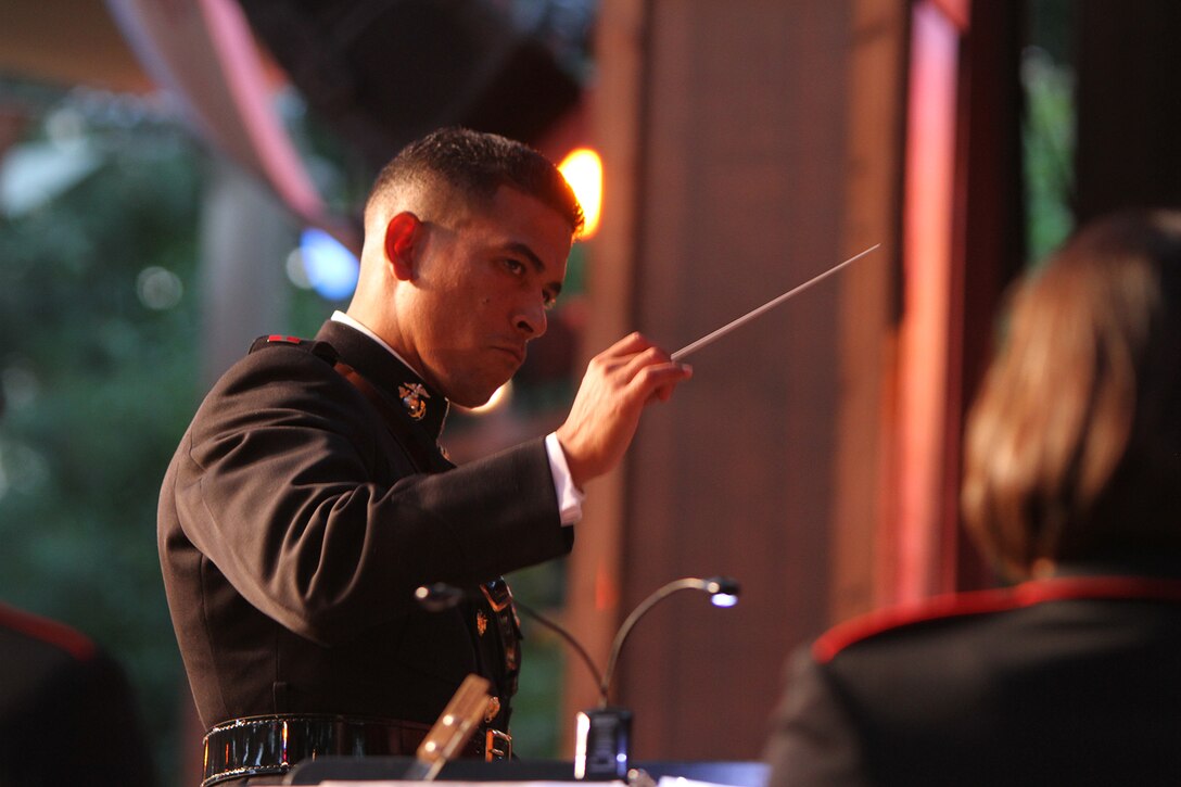 Warrant Officer Andres Navarro, officer in charge of the 3rd Marine Aircraft Wing Band, conducts the band during an Independence Day concert at the Disneyland Resort in Anaheim, Calif., July 4. This is the third year the band was featured during Disneyland’s Independence Day celebration.