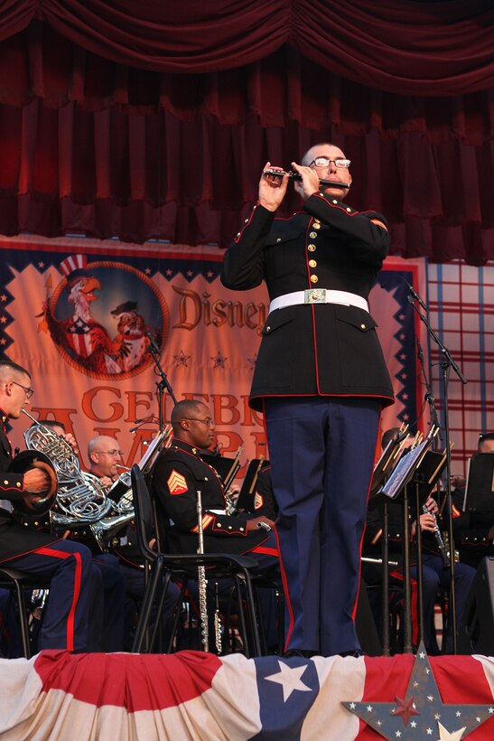 Cpl. Jesse Tingle, a musician with the 3rd Marine Aircraft Wing, plays a solo during an Independence Day concert at the Disneyland Resort in Anaheim, Calif., July 4. In addition to patriotic melodies, the band engaged the audience in interactive performances, inviting the guests to sing along with popular tunes and to stand to be recognized for military service.