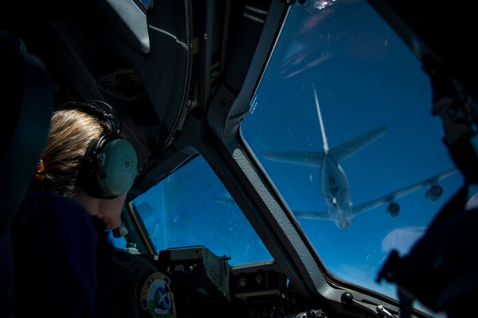 Lt. Col. Debi Rieflin, 315th Operations Group aircrew training chief, watches as a 927th Air Refueling Wing KC-135 Stratotanker prepares to fuel a C-17 Globemaster III July 1, 2014. C-17 Globemaster IIIs rely on aerial refueling to complete long-distance missions into and out of the theater of operations. Rieflin was a member of the initial cadre of C-17 pilot teams that flew C-17s to Charleston Air Base more than 20 years ago, and was also participating in Col. Tony Schenk’s ‘fini flight,’ an aviation tradition in which aircrew members are met by their unit comrades, family and friends and soaked with water after completing their final flight with their unit. (U.S. Air Force photo/ Airman 1st Class Clayton Cupit)