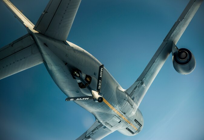 A 927th Air Refueling Wing KC-135 Stratotanker soars overhead after refueling a C-17 Globemaster III July 1, 2014. C-17 Globemaster IIIs rely on aerial refueling to complete long-distance missions into and out of the theater of operations. (U.S. Air Force photo/ Airman 1st Class Clayton Cupit)