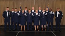 Chief Master Sgt. Richard L. Etchberger Airman Leadership School Class 14-Echo (Air National Guard flight) pose for a group photo with their ALS instructor and class mentor moments before a graduation ceremony held June 26, 2014, at the Northern Lights Club on Grand Forks Air Force Base, N.D. Class 14-E was made up by two groups of students more commonly referred to in the Air Force as flights. One flight consisted of 12 active-duty Airmen completing their in-residence course at the Etchberger ALS in Grand Forks AFB, while the other flight was made up of a dozen Air National Guard Airmen from the 119th Wing attending an in-residence ALS course at the North Dakota ANG base in Fargo, N.D. Both of the flights were simultaneously taught by Air Force active-duty instructors from the Etchberger ALS. This new approach on training was the first of its kind according to officials from the 119th Wing and the 319th Air Base Wing. (U.S. Air Force photo/Staff Sgt. Luis Loza Gutierrez)
