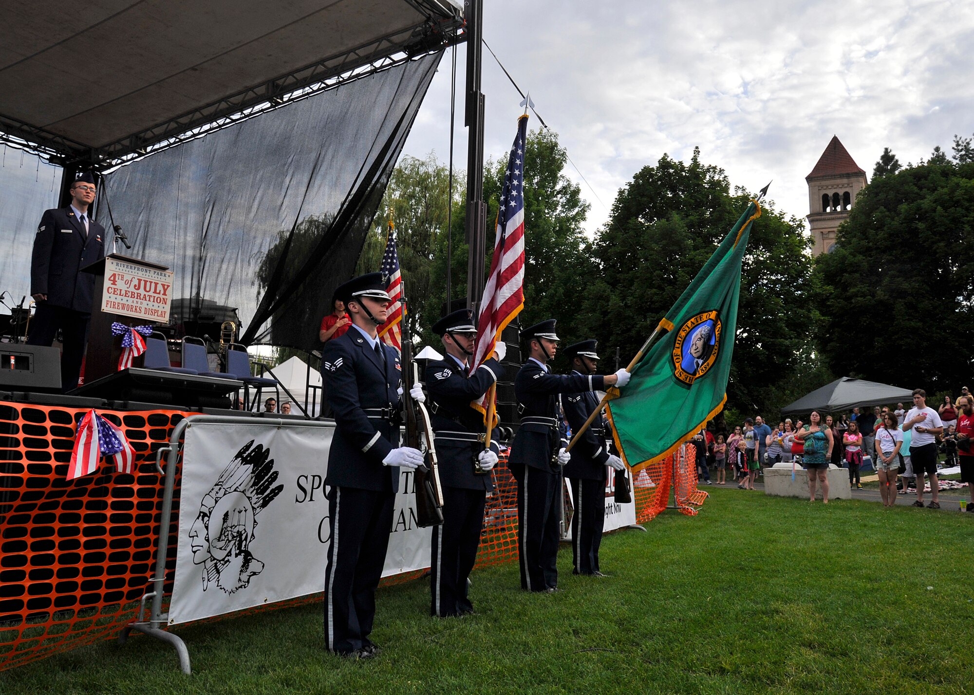 Members of the Fairchild Air Force Base honor guard present the colors at the Riverfront Park 4th of July Celebration at Spokane, Washington, July 4, 2014. (U.S. Air Force photo by Staff Sgt. Michael Means/Released)