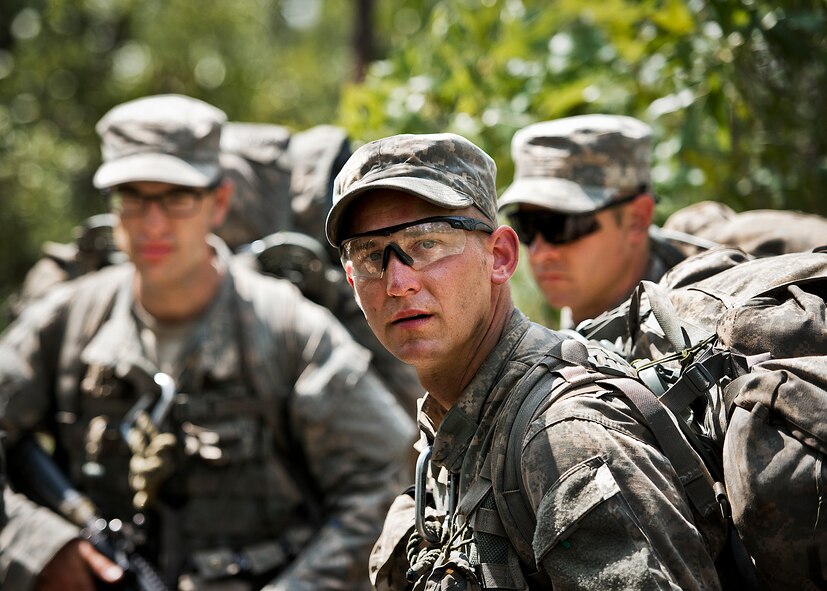 An Army Ranger student checks his six in the woods of the Eglin Air Force Base, Fla., range.  Students complete the final phase of the Army Ranger course with the 6th Ranger Training Battalion.  Instructors expose the students to an 18-day field training that includes airborne and helicopter assaults, small boat operations, river and swamp crossings.  (U.S. Air Force photo/Tech. Sgt. Samuel King Jr.)