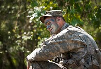 An Army Ranger student enjoys a bit of down time during a field training exercise in the woods of the Eglin Air Force Base, Fla., range.  Students complete the final phase of the Army Ranger course with the 6th Ranger Training Battalion.  Instructors expose the students to an 18-day field training that includes airborne and helicopter assaults, small boat operations, river and swamp crossings. (U.S. Air Force photo/Tech. Sgt. Samuel King Jr.)