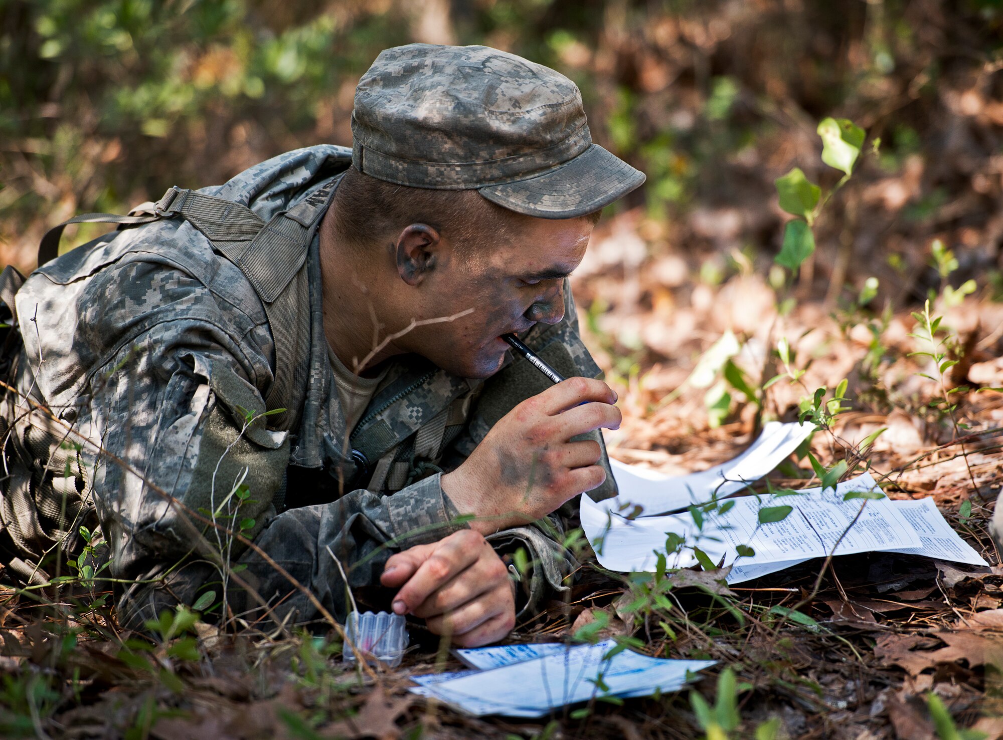 An Army Ranger student contemplates a strategy in the woods of the Eglin Air Force Base, Fla., range.  Students complete the final phase of the Army Ranger course with the 6th Ranger Training Battalion.  Instructors expose the students to an 18-day field training that includes airborne and helicopter assaults, small boat operations, river and swamp crossings. (U.S. Air Force photo/Tech. Sgt. Samuel King Jr.)