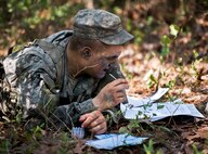 An Army Ranger student contemplates a strategy in the woods of the Eglin Air Force Base, Fla., range.  Students complete the final phase of the Army Ranger course with the 6th Ranger Training Battalion.  Instructors expose the students to an 18-day field training that includes airborne and helicopter assaults, small boat operations, river and swamp crossings. (U.S. Air Force photo/Tech. Sgt. Samuel King Jr.)