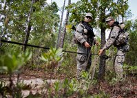 Army Ranger students practice their rope tying procedures prior to a river crossing during a field training exercise in the woods of the Eglin Air Force Base, Fla., range.  Students complete the final phase of the Army Ranger course with the 6th Ranger Training Battalion.  Instructors expose the students to an 18-day field training that includes airborne and helicopter assaults, small boat operations, river and swamp crossings. (U.S. Air Force photo/Tech. Sgt. Samuel King Jr.)