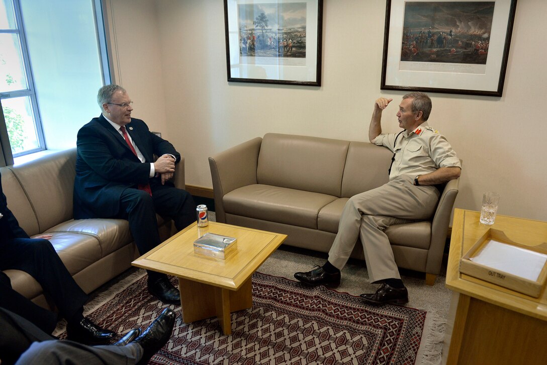 U.S. Deputy Defense Secretary Bob Work, left, meets with British Gen. Sir Nicholas Houghton, chief of defense staff, at the British Ministry of Defense in London, July 3, 2014.