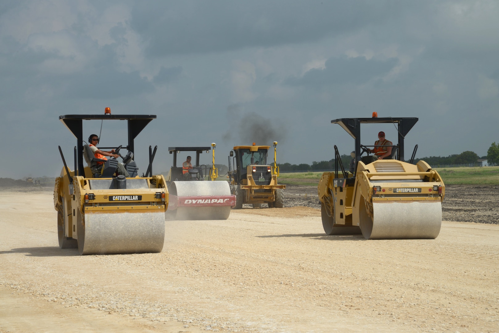 820th Rapid Engineer Deployable Heavy Operational Repair Squadron Engineer heavy equipment operators operate tantem vibratory rollers to ensure the maximum compaction of material under the runway surface June 23 at Joint Base San Antonio-Randolph's Seguin Auxiliary Airfield. (U.S. Air Force photo by Joel Martinez)