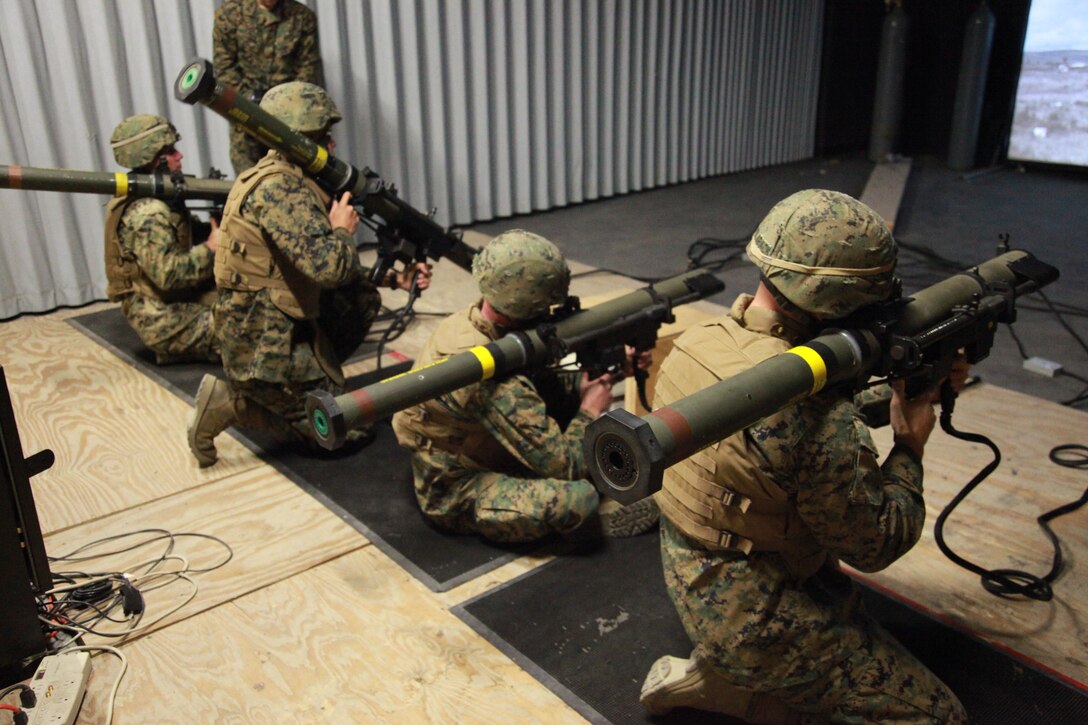 U.S. Marines with Weapons Platoon, Lima Company, 3rd Battalion, 1st Marine Regiment practice marksmanship with the shoulder-launched multipurpose assault weapon in the indoor simulated marksmanship trainer at Camp Horno, at Camp Pendleton, Calif., Nov. 24, 2009. The 3rd Battalion is preparing for upcoming deployments. (U.S. Marine Corps photo by Lance Cpl. Brandyn E. Council/Released)
