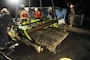 Archeologists working for the U.S. Army Corps of Engineers, Savannah District, and divers and salvage operations teams from the U.S. Navy, retrieve a 64-square foot section of a Civil War ironclad warship from the bottom of the Savannah River the evening of Nov. 12, 2013. U.S. Navy photo. (Photo by US Navy)