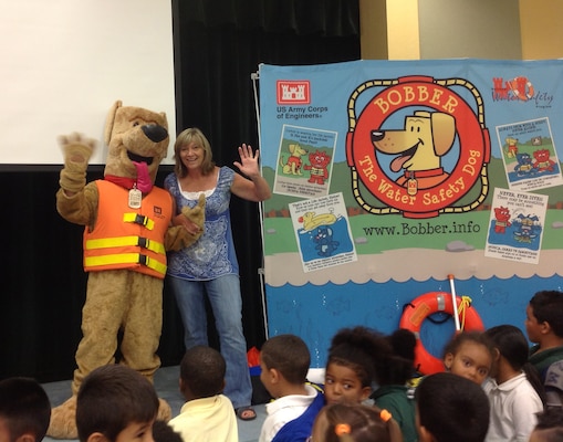 Ellen Smith, gym and wellness teacher at Gove Elementary School in Belle Glade, Florida welcomes Bobber the Water Safety Dog to her class.