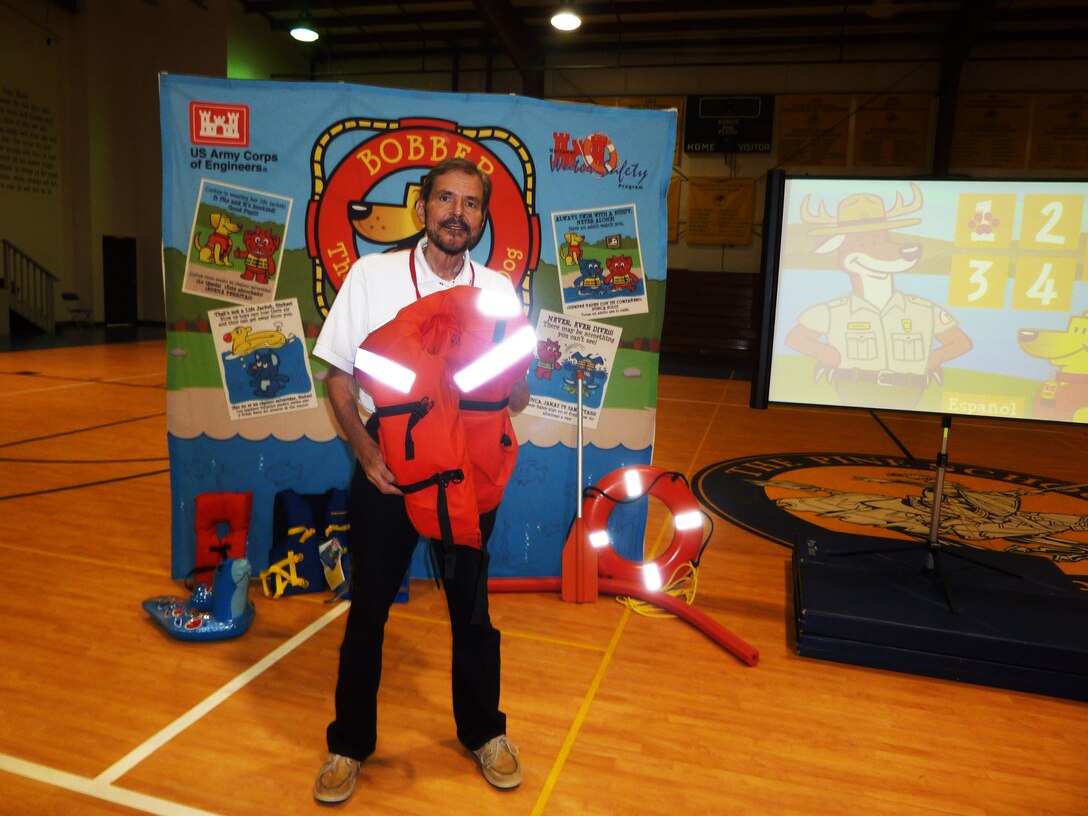 Water safety volunteer Bill Wagner teaches students how to “Wear it tight and wear it right!”