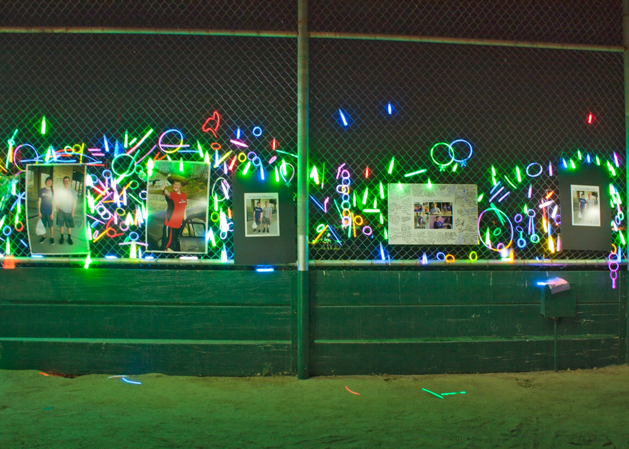 A vigil was held July 2 at Desert High School in remembrance of John Michael Burgess and Christopher Alan Ricker. Both teens were killed when a tractor-trailer truck struck their car at the intersection of 60th St. W. and SR-138 June 30. (Courtesy photo by Master Sgt. John McGee)