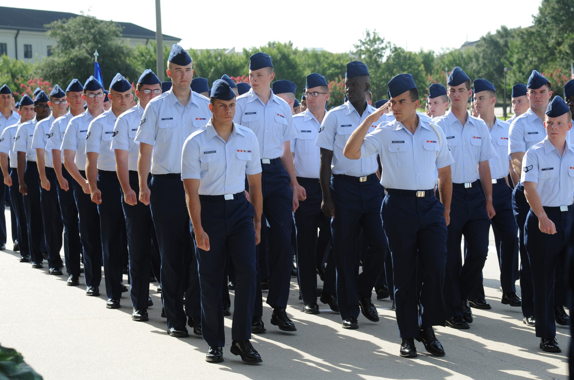 Troops from the 81st Training Group march during pass and review following the 2nd Air Force change of command ceremony July 3, 2014, at Keesler Air Force Base, Miss.  Maj. Gen. Leonard Patrick, former commander, is replaced by Brig. Gen. Mark Brown who was previously the Financial Management director, Headquarters Air Force Material Command at Wright-Patterson Air Force Base, Ohio. (U.S. Air Force photo by Kemberly Groue)