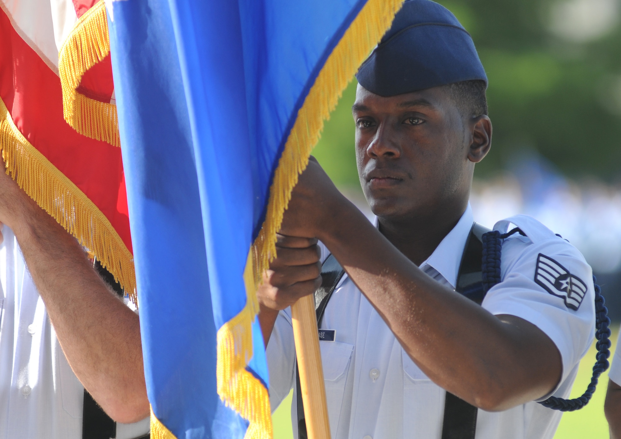 Staff Sgt. Jamarvis Rease, 338th Training Squadron military training leader, holds the Air Force flag during the 2nd Air Force change of command ceremony July 3, 2014, at Keesler Air Force Base, Miss.  Brig. Gen. Mark Brown assumed command at the ceremony from Maj. Gen. Leonard Patrick. Brown was previously the Financial Management director, Headquarters Air Force Material Command at Wright-Patterson Air Force Base, Ohio. Patrick is headed to Randolph Air Force Base, Texas, where he will become the AETC vice commander.  (U.S. Air Force photo by Kemberly Groue)